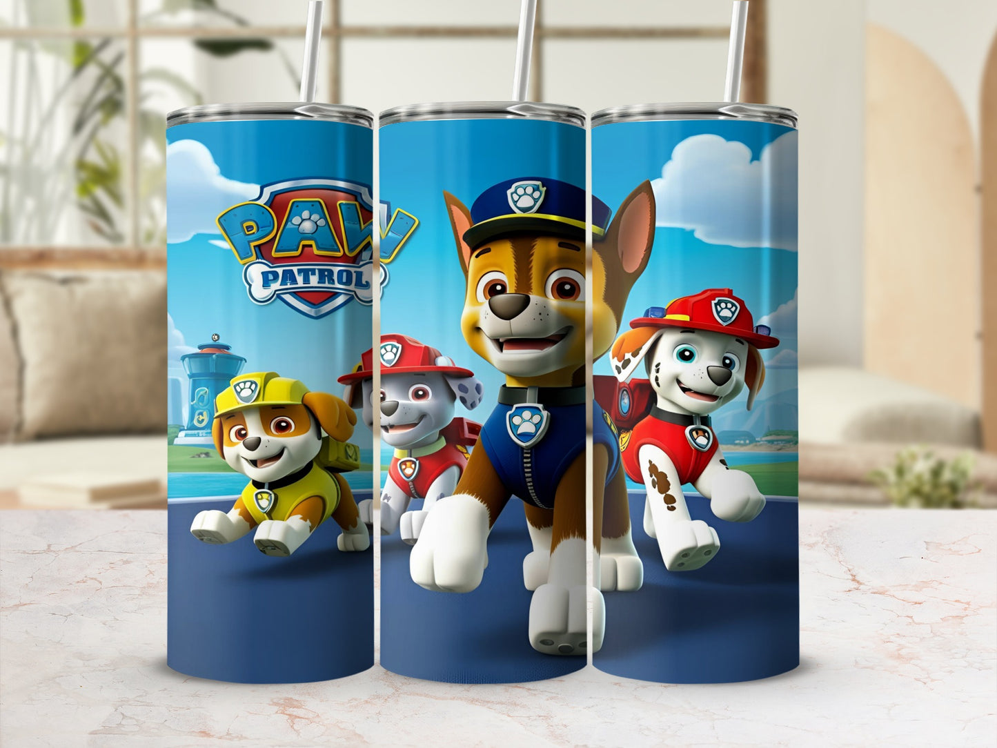 Paw Patrol characters Chase, Marshall, and Rubble on a blue tumbler.