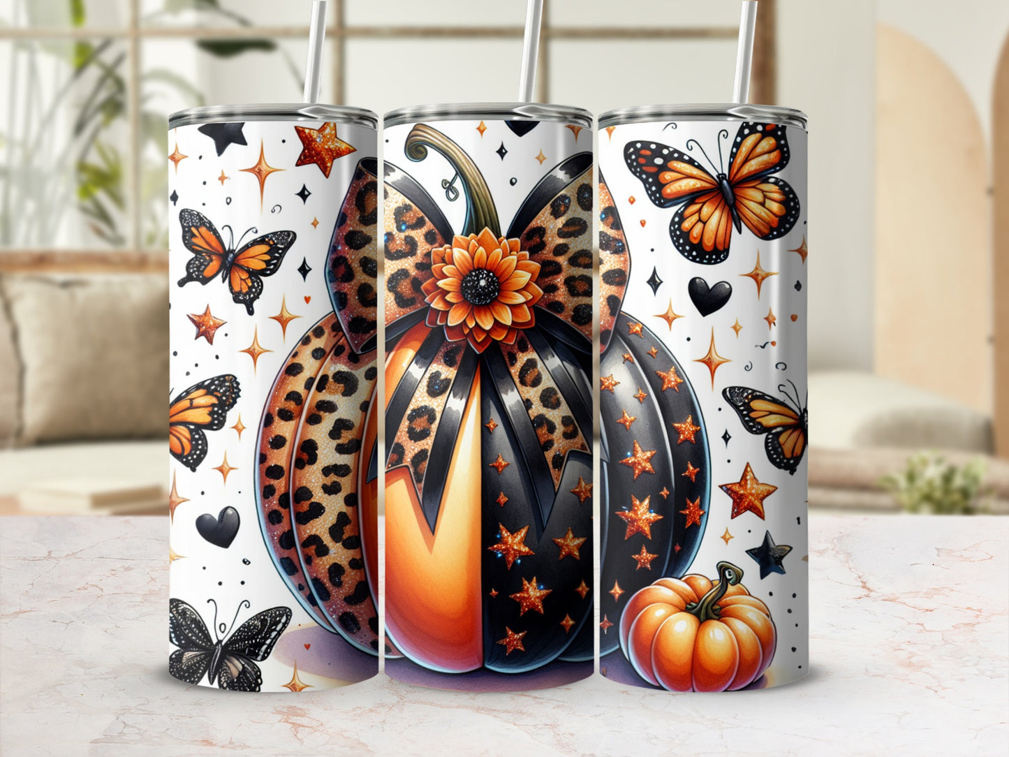 Three tumblers feature pumpkins with leopard print, stars, butterflies, and hearts.