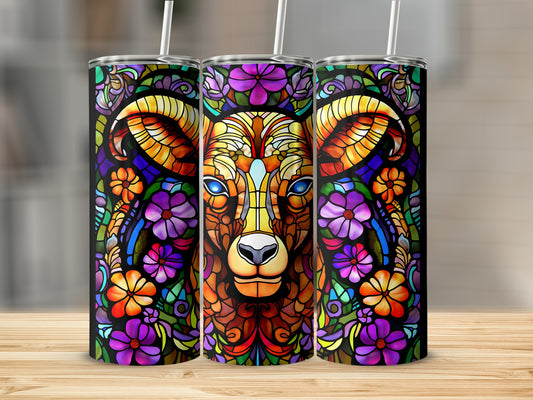 Stained glass ram with colorful floral accents on a skinny tumbler.