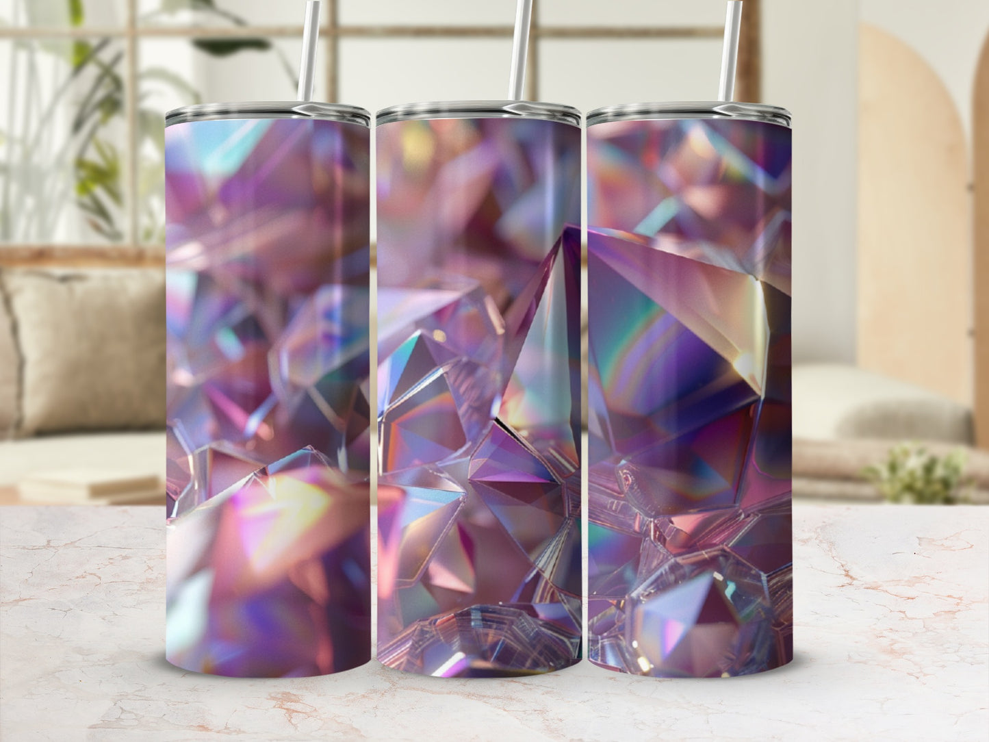 Three tumblers with iridescent, crystal-like designs and straws.