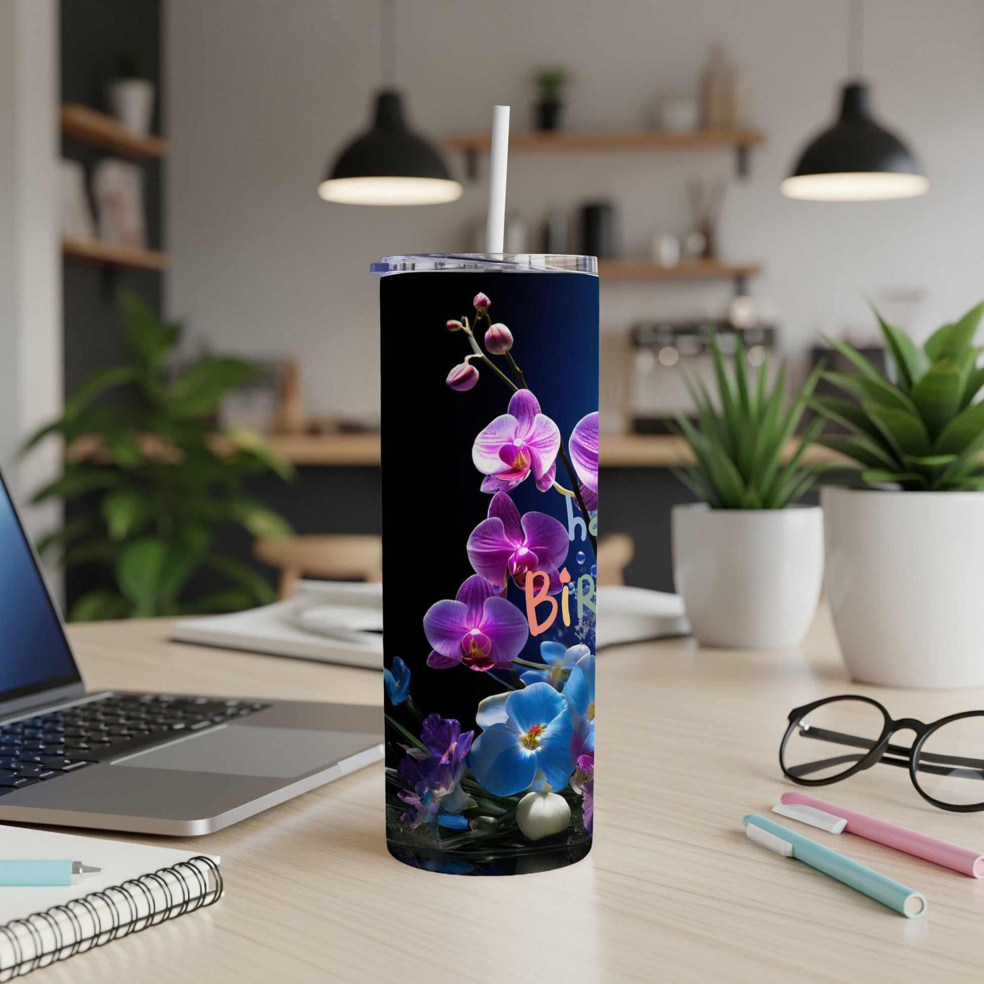 Blue and purple orchids on a dark blue tumbler with "The Birthday" text.