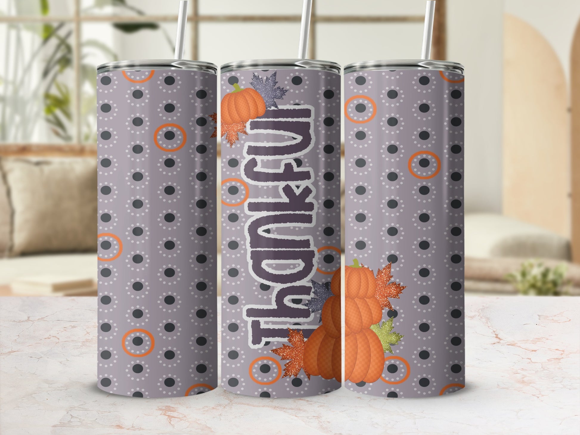 Gray tumbler with polka dots, "Thankful" text, and pumpkin and leaf graphics.