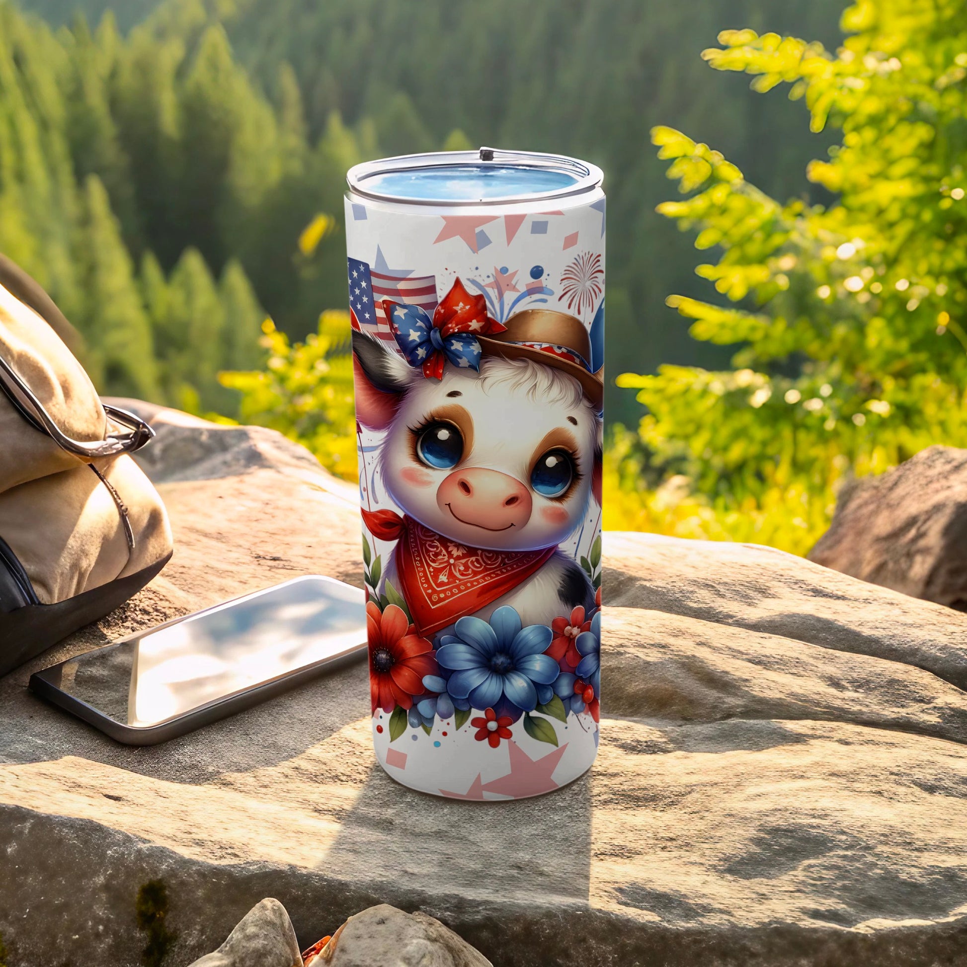 Patriotic cow tumbler with American flag accents and floral design.