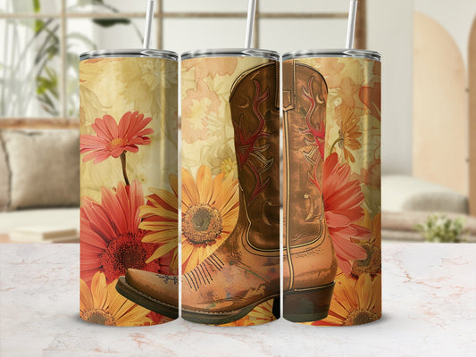 Brown cowboy boot with floral pattern on tumbler.