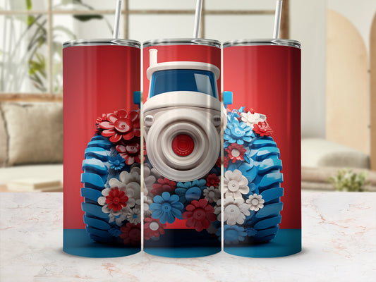 Red, white, and blue floral tractor tumbler with white straw.