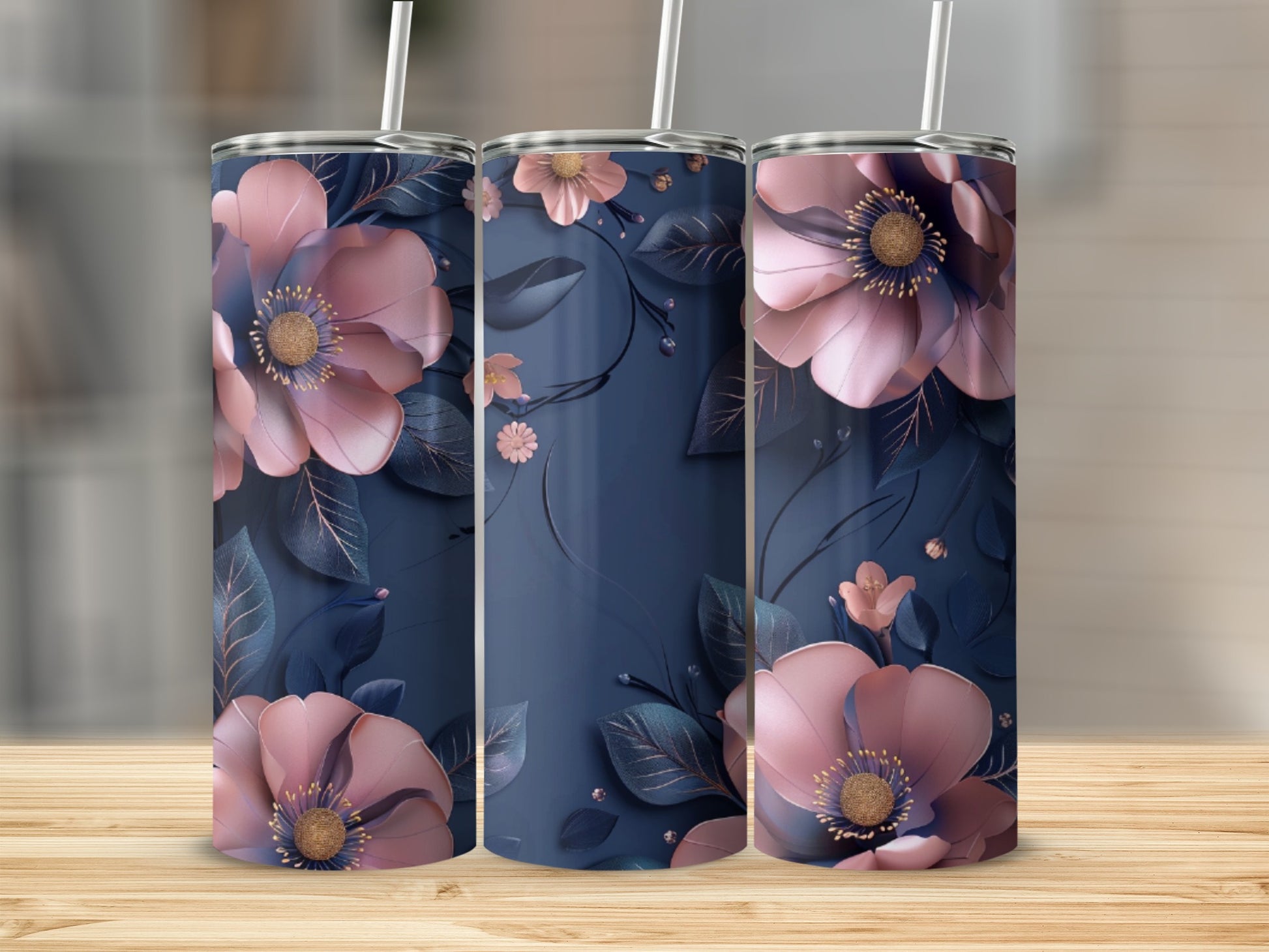 Three navy tumblers with large pink floral designs and rose gold accents.