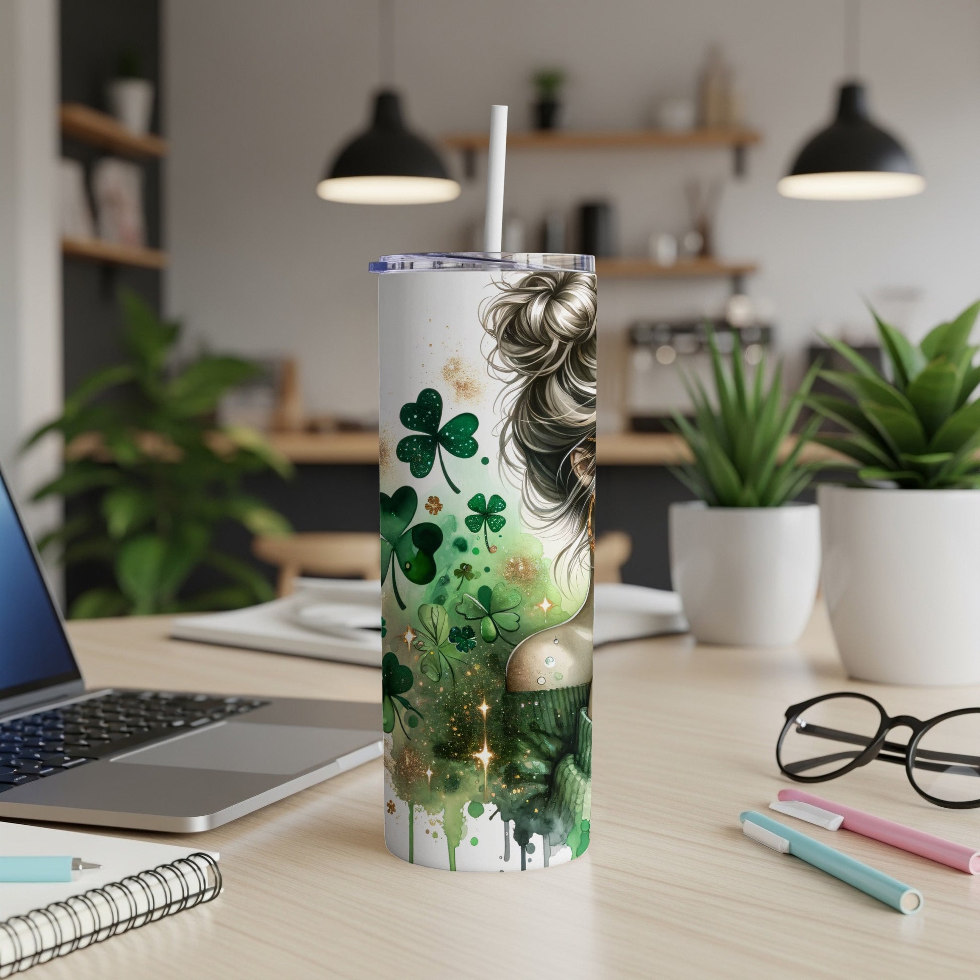 Green tumbler with shamrocks and sparkles, straw in lid.