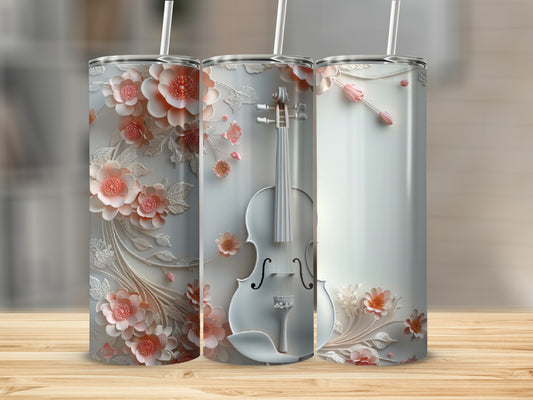 Three tumblers: one with floral design, one with a violin, one with floral accents.