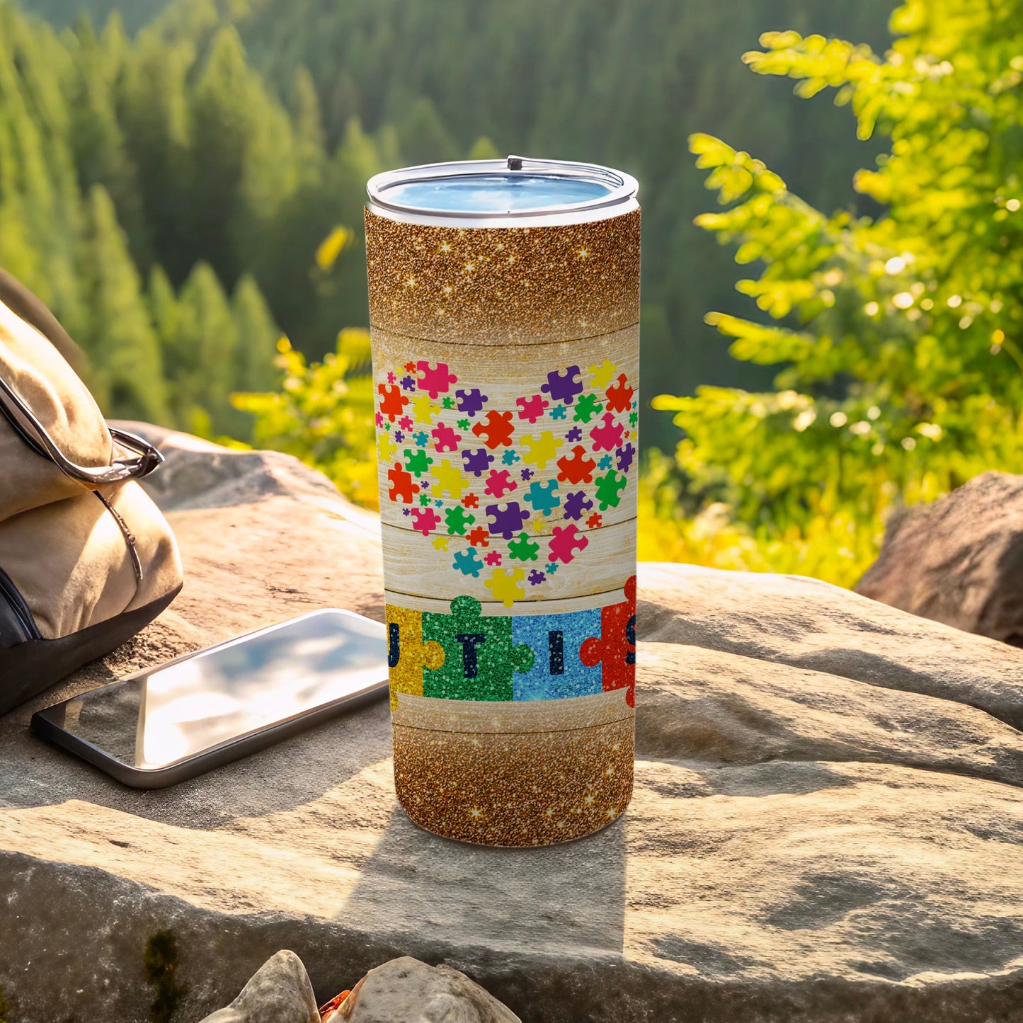 Glitter tumbler with colorful puzzle pieces and wood grain heart pattern.