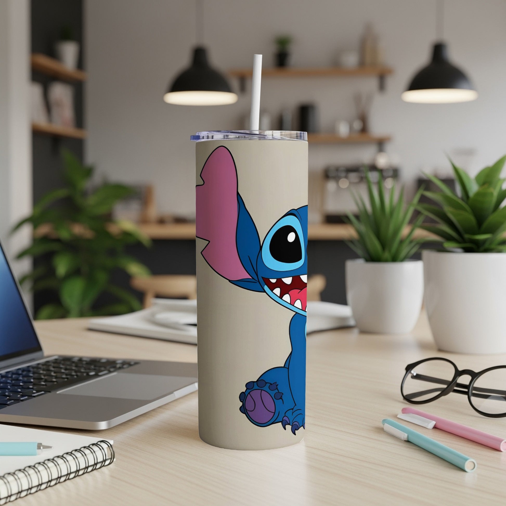Stitch character on a tan travel tumbler with a straw.