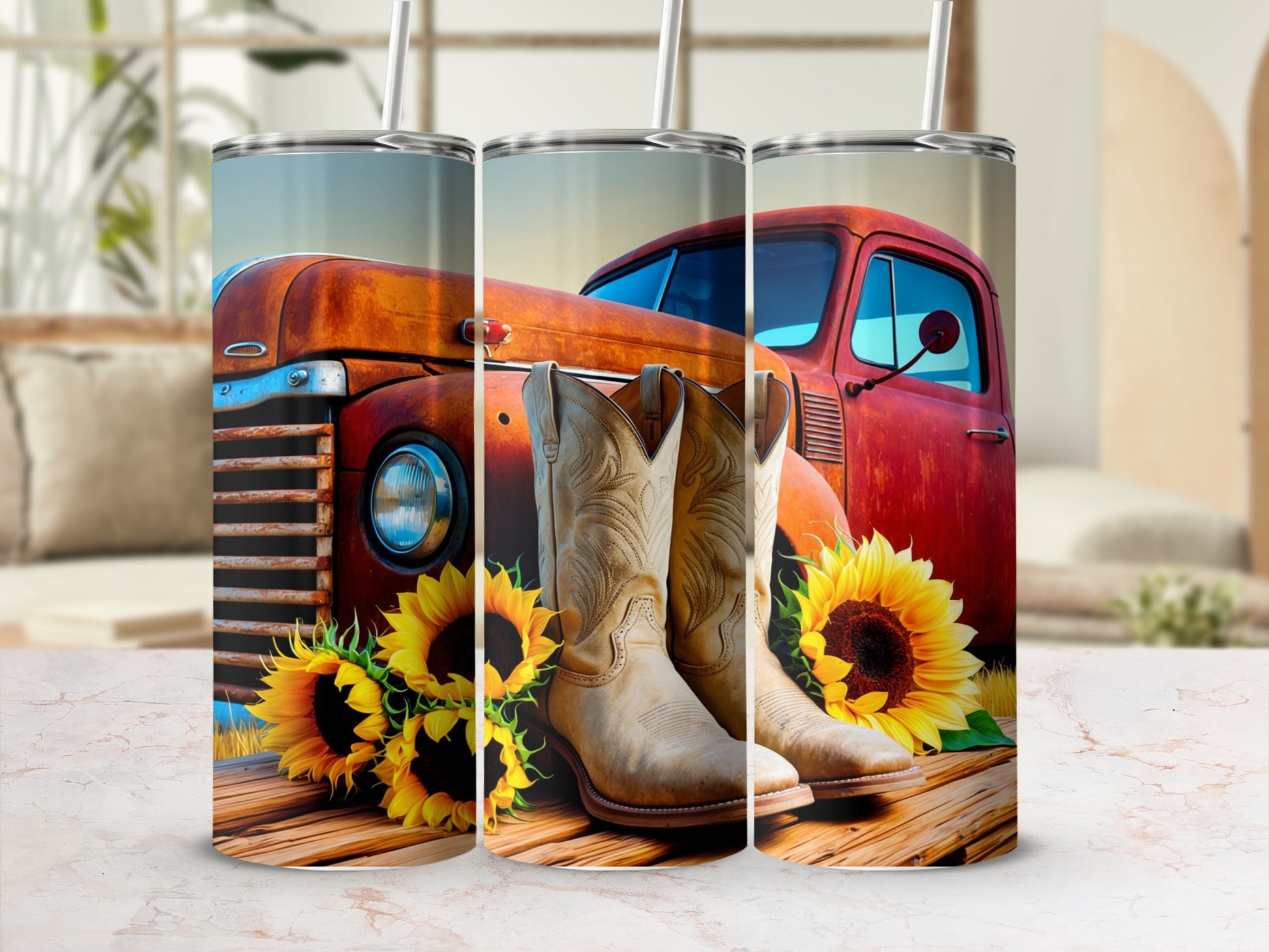 Cowboy boots and sunflowers rest on a wooden surface in front of a vintage red truck.