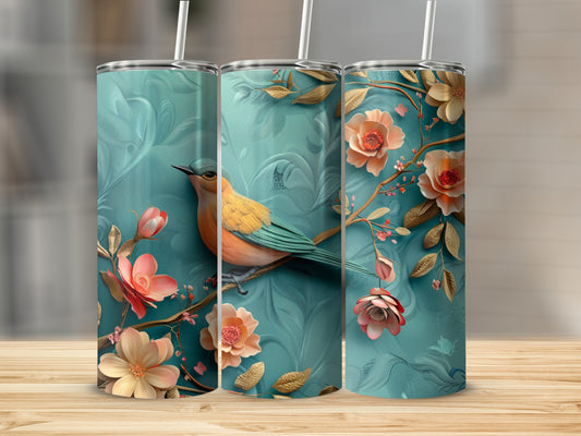 Turquoise tumbler with a bird and floral design.