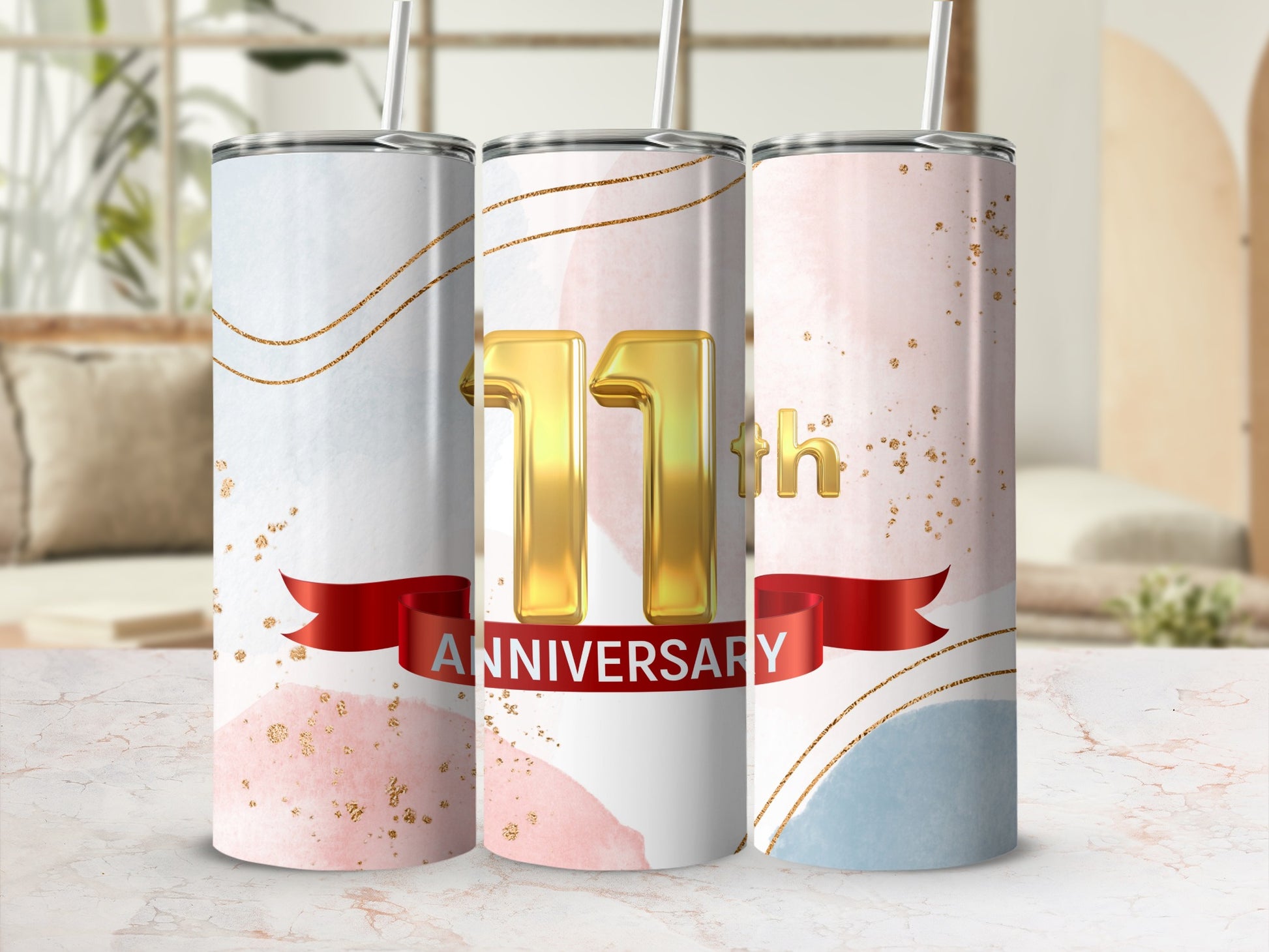 Three tumblers celebrating an 11th anniversary with gold text and watercolor accents.