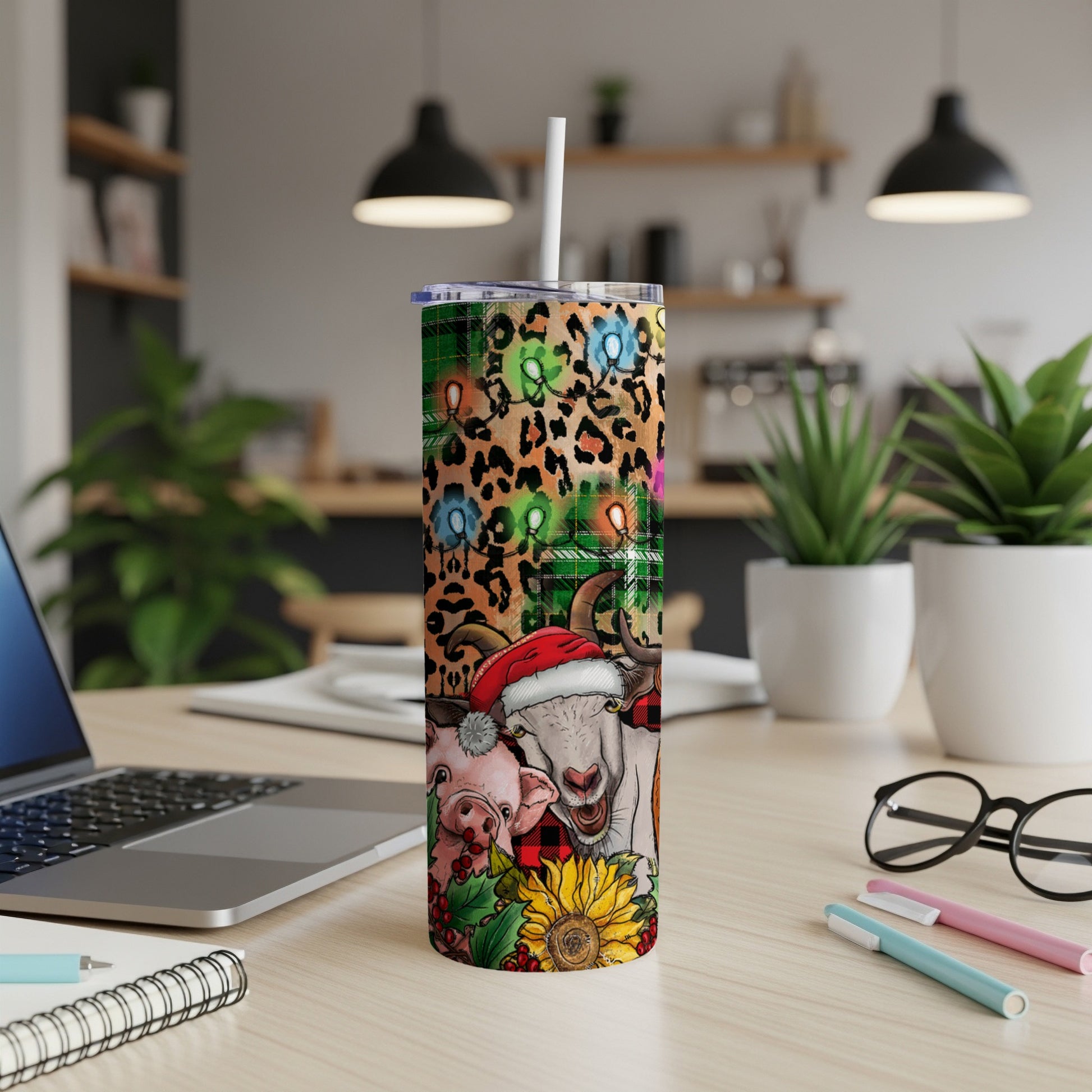 Christmas tumbler with pig, goat, and sunflower designs.