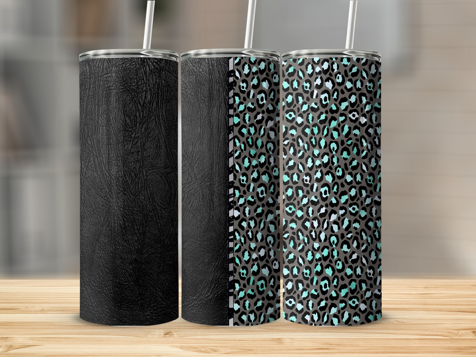 Three tumblers on a wooden surface, two with leopard print.
