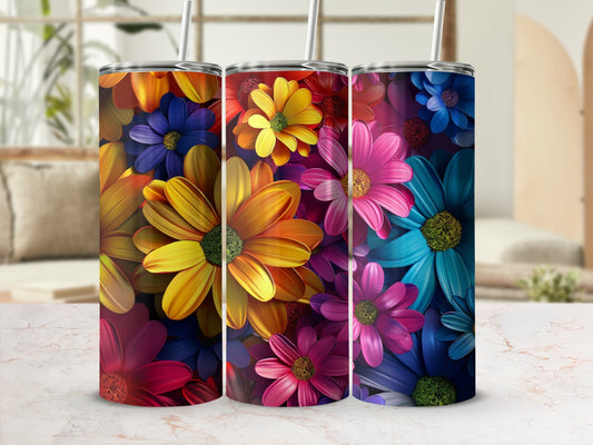 Three colorful tumblers with floral patterns, featuring red, yellow, and blue flowers.