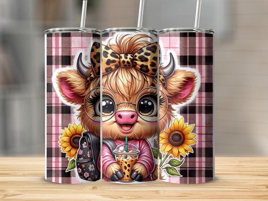 Cow with glasses and leopard bow holding boba tea, with sunflowers.