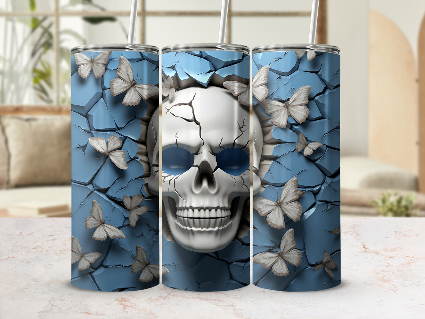 Three tumblers with a cracked blue background and a skull with blue eyes and butterflies.