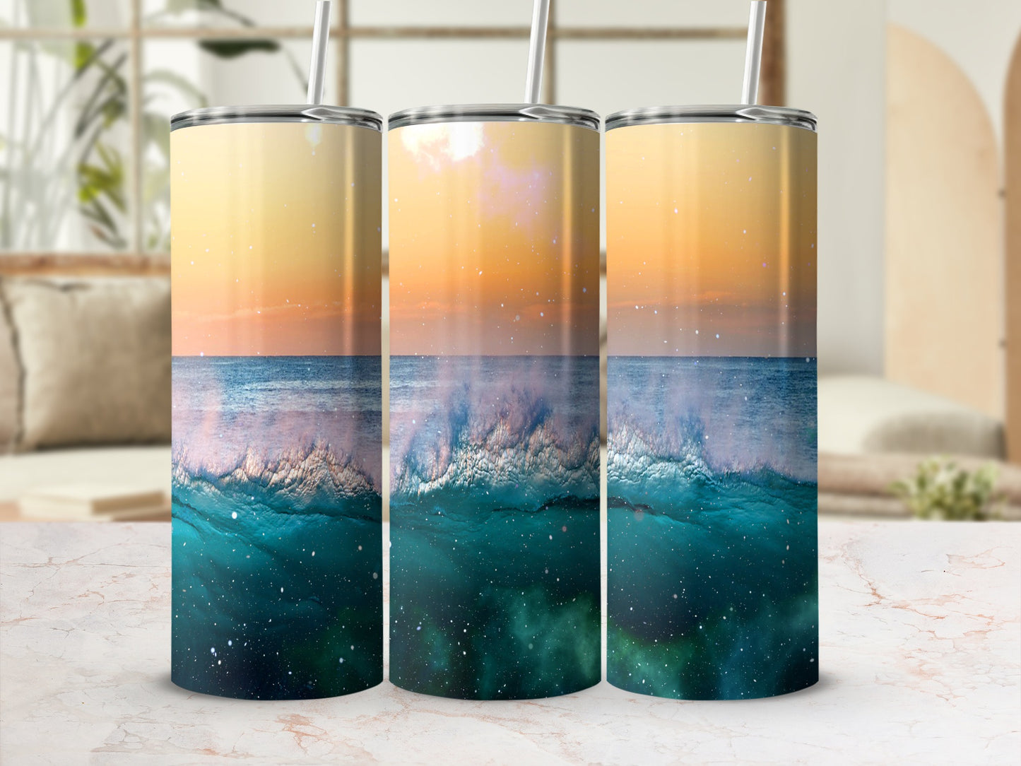 Three tumblers with ocean wave and starry sky design.