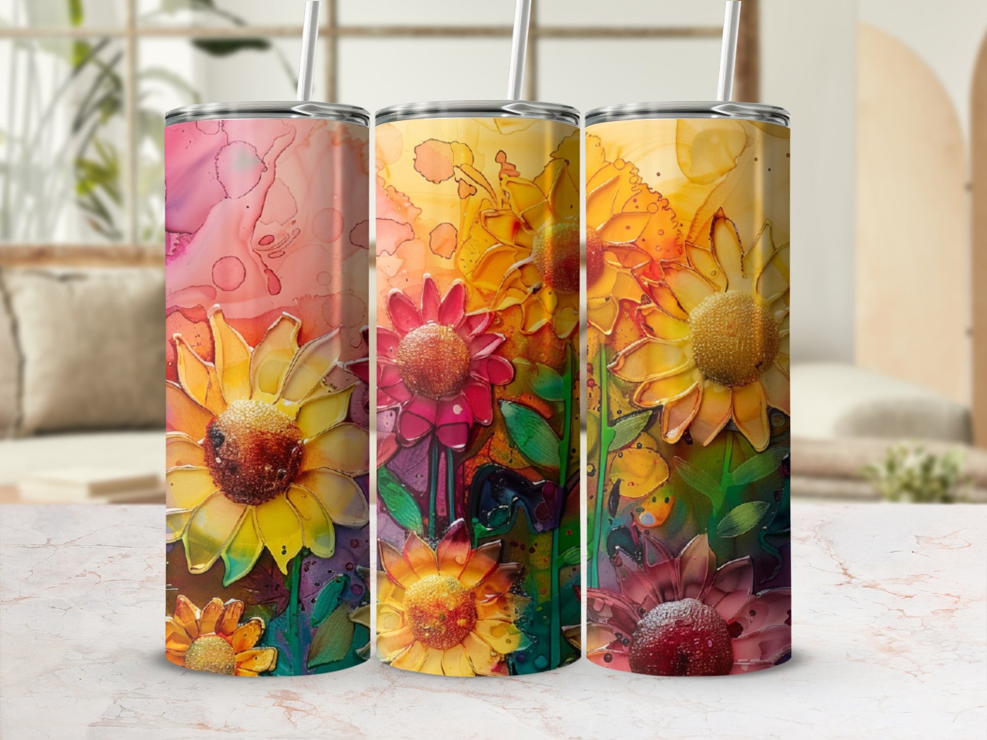 Three tumblers featuring vibrant watercolor sunflowers and abstract floral patterns.