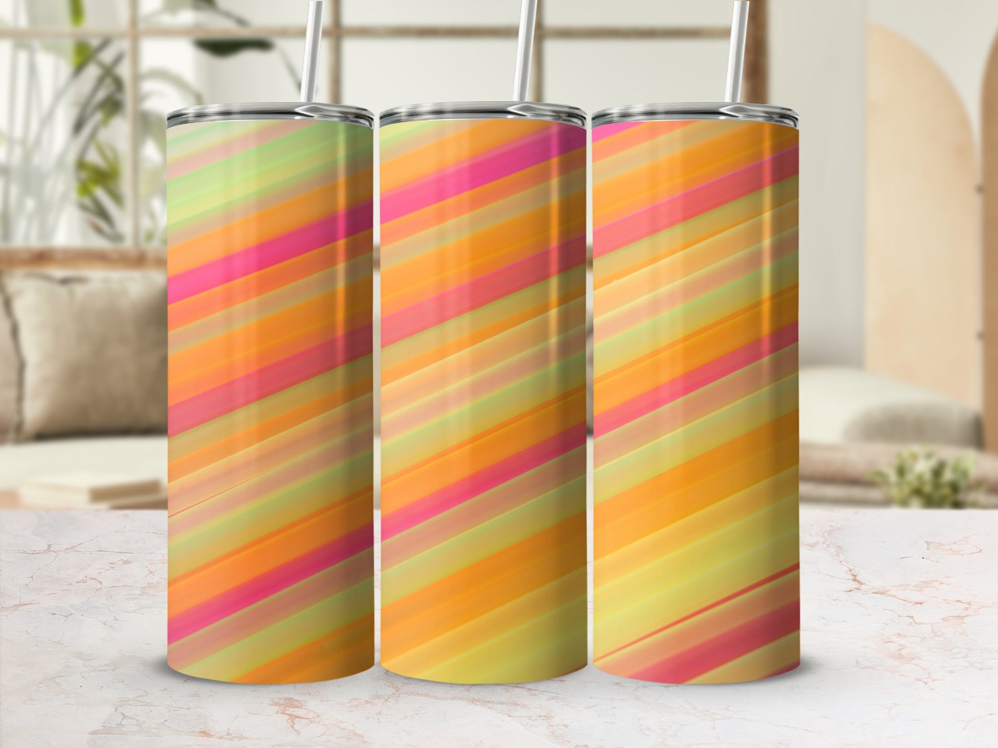 Three tumblers with diagonal abstract stripes in pink, orange, and green.