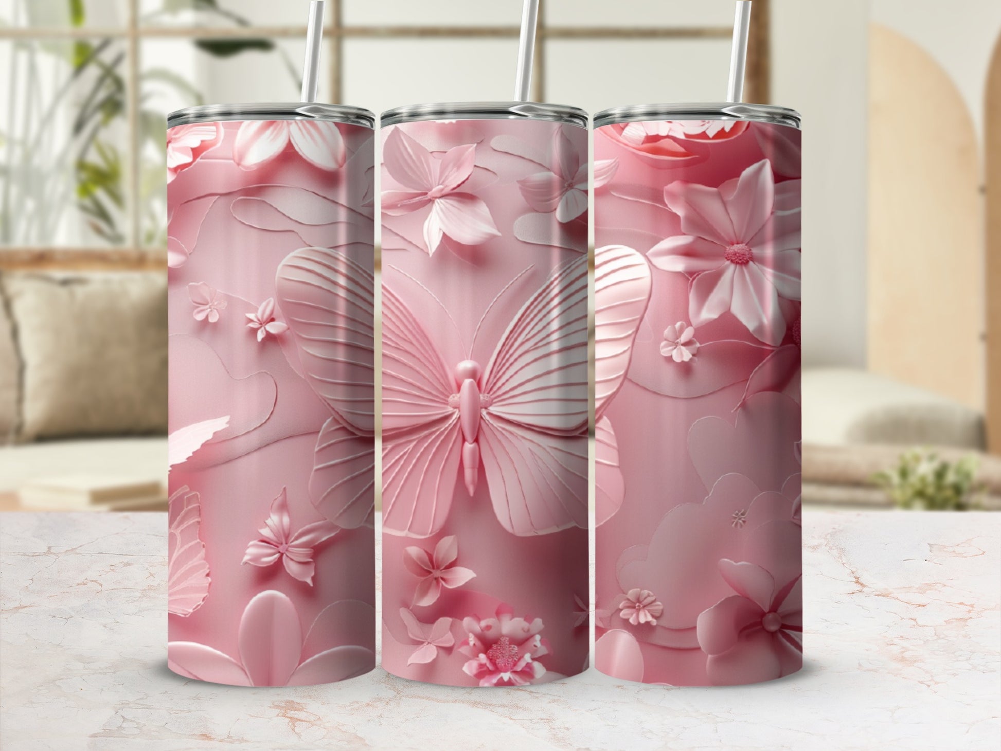 Pink tumbler with embossed butterfly and floral pattern.