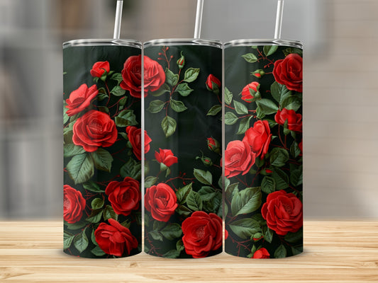 Three tumblers decorated with red roses and dark green leaves.