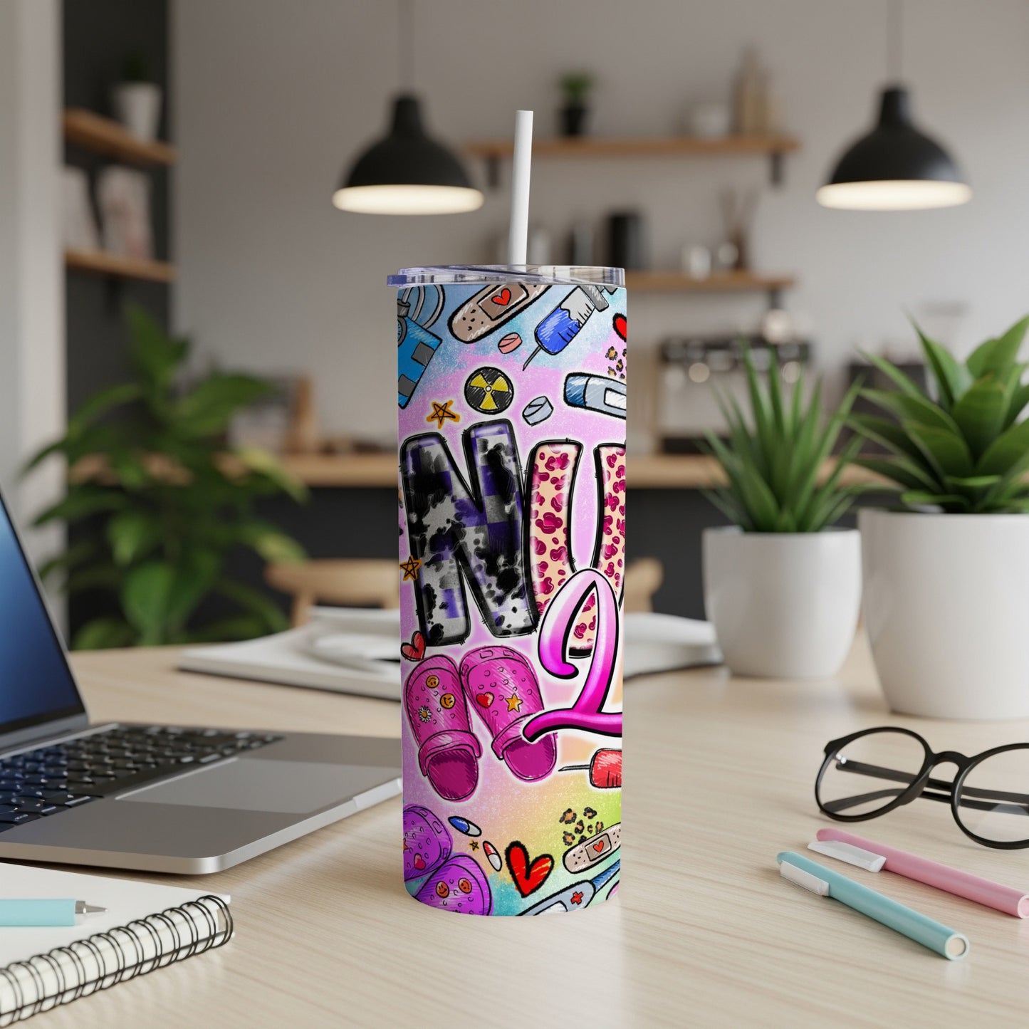 Pink and purple tumbler with nursing icons and "Nurse" text.