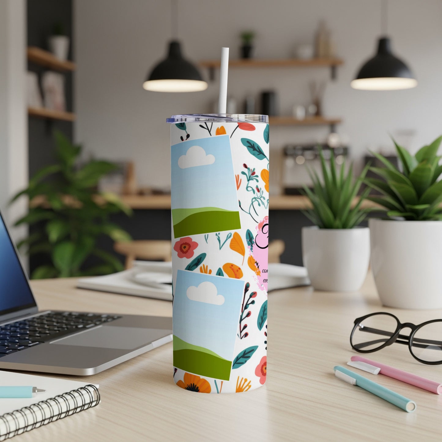 Tumbler with floral pattern and photo frames featuring sky and landscapes.