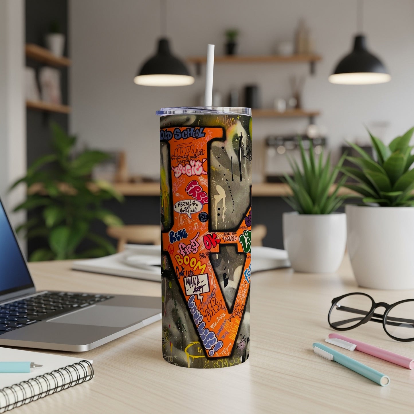 Graffiti-covered tumbler with "OLD SCHOOL" and "LOVE" text, featuring a straw.