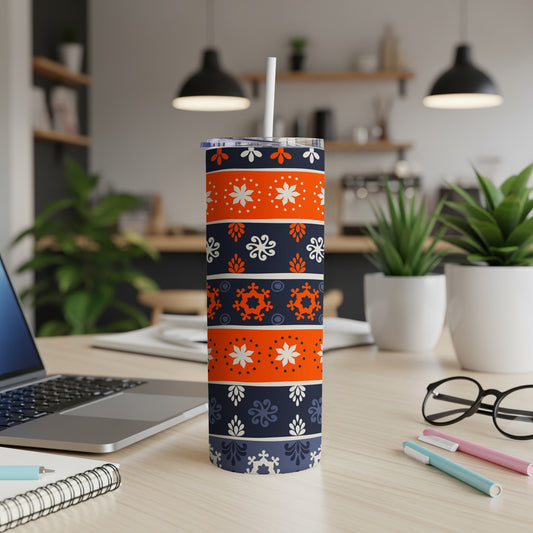 Orange and blue snowflake pattern tumbler with white lid and straw.