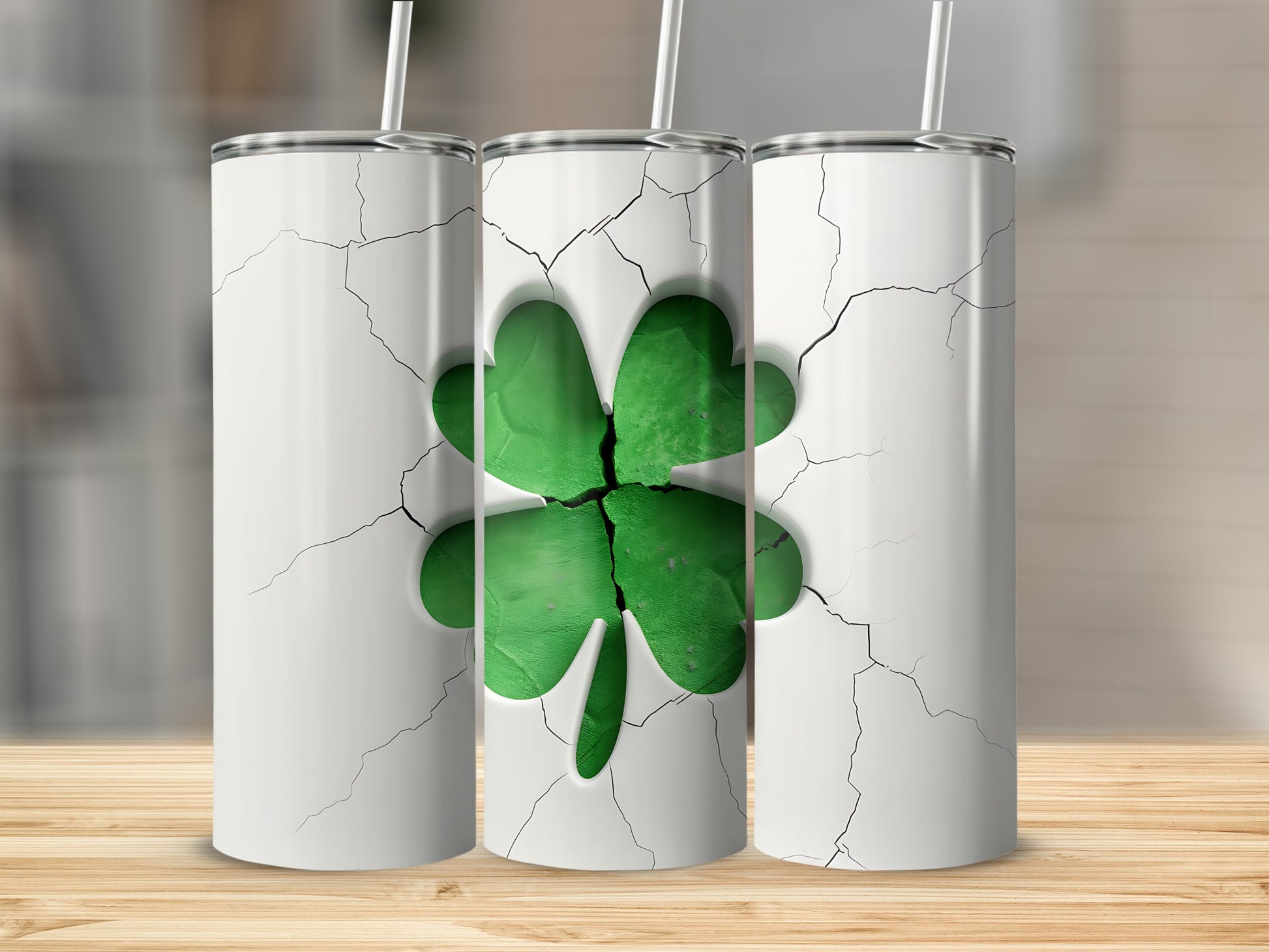 Cracked white tumbler with a green four-leaf clover design.