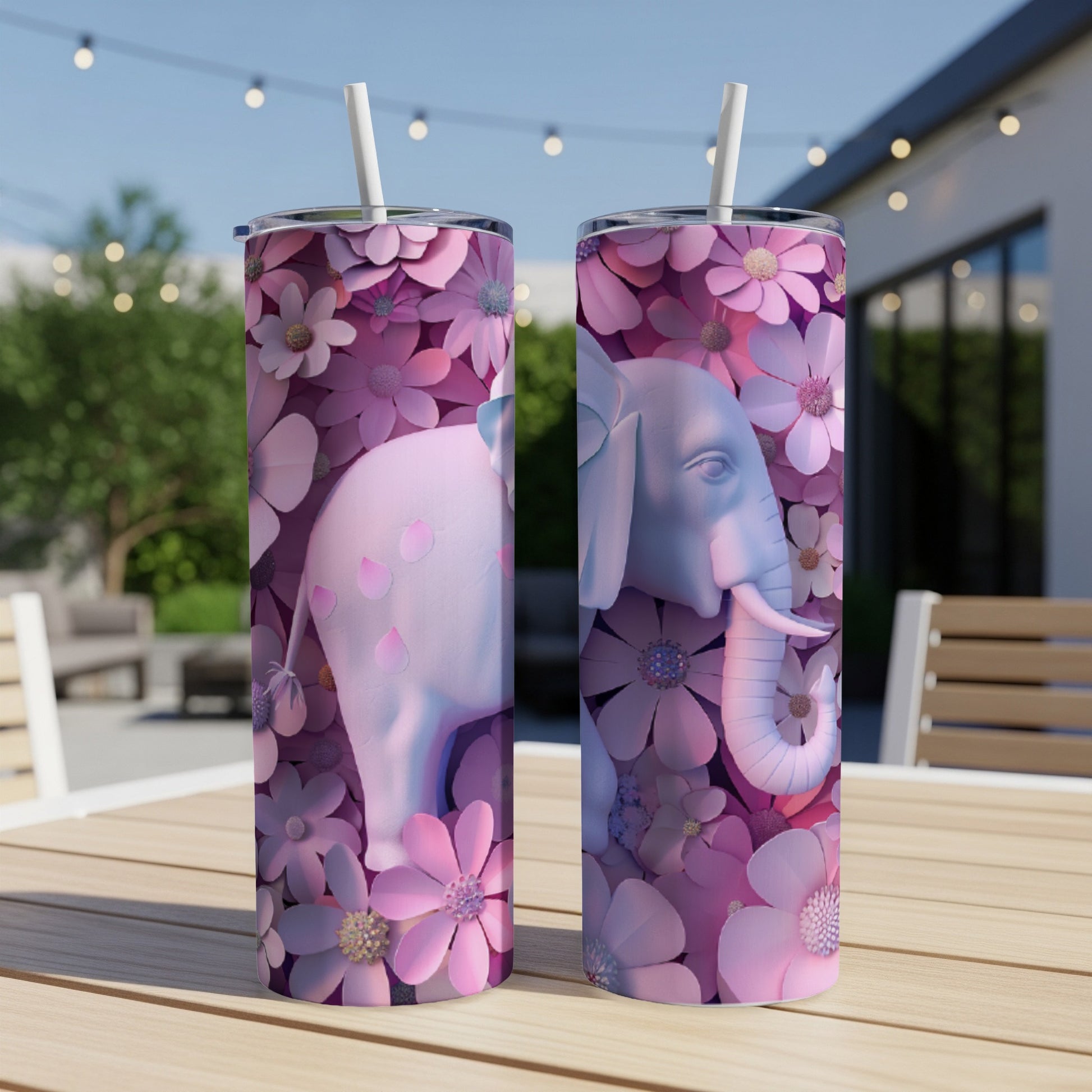 Pink elephant with floral pattern on a white tumbler with straw.