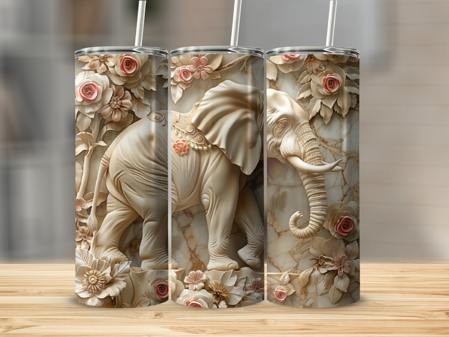 Three tumblers with a relief elephant and floral design.