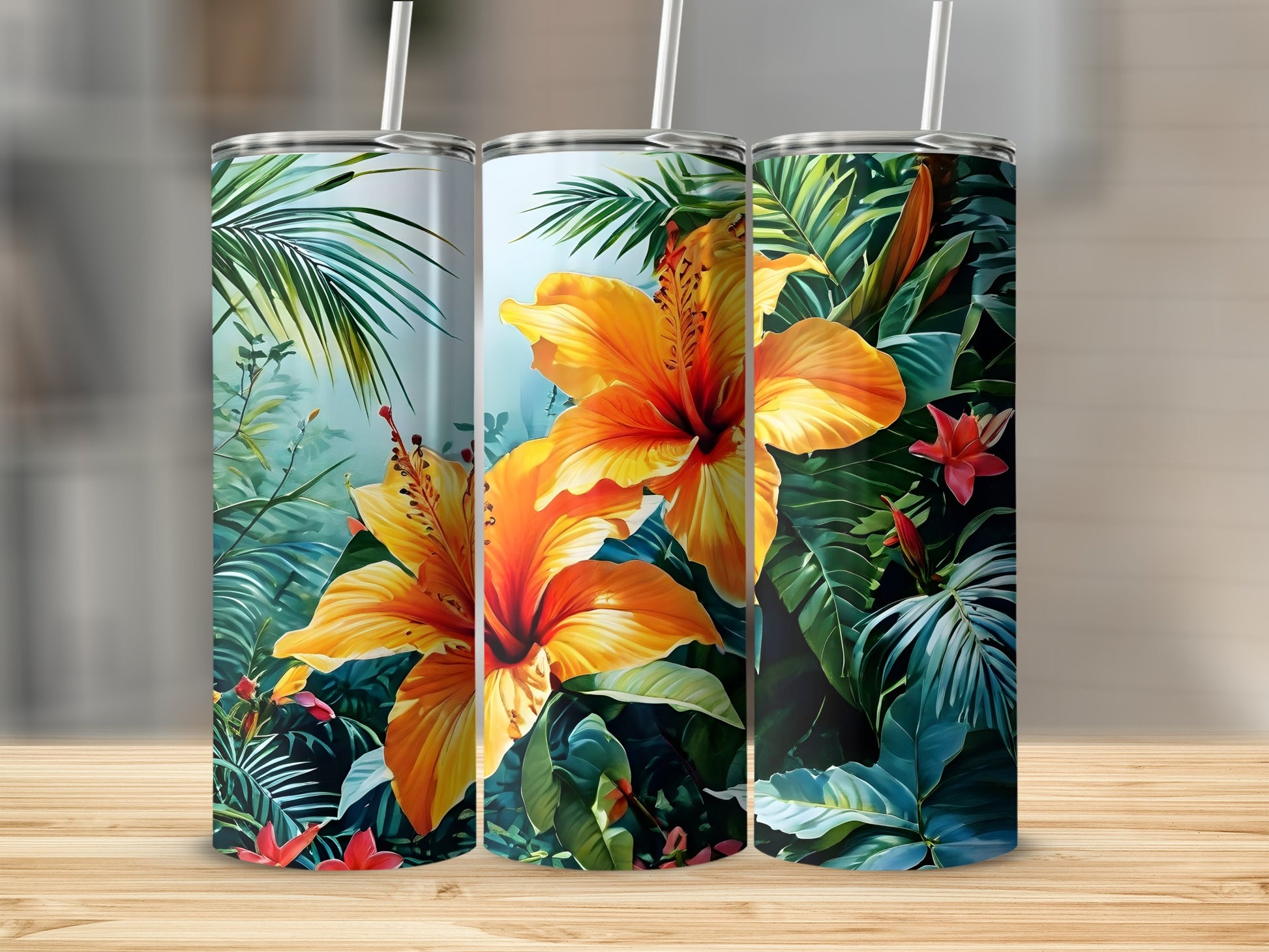 Three tumblers with tropical hibiscus flowers and palm leaves.