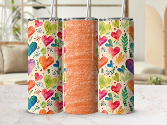 Three tumblers with a colorful heart pattern and textured orange design.