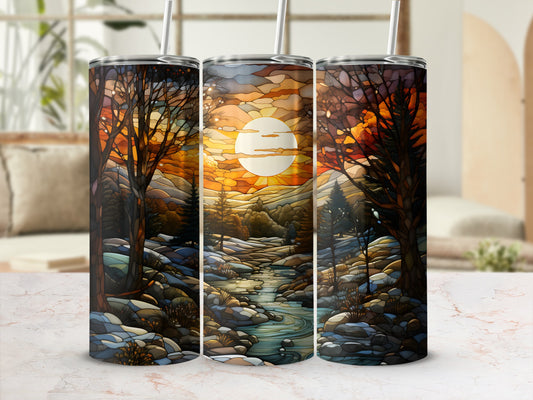 Three tumblers featuring a sunset landscape with trees and a stream.