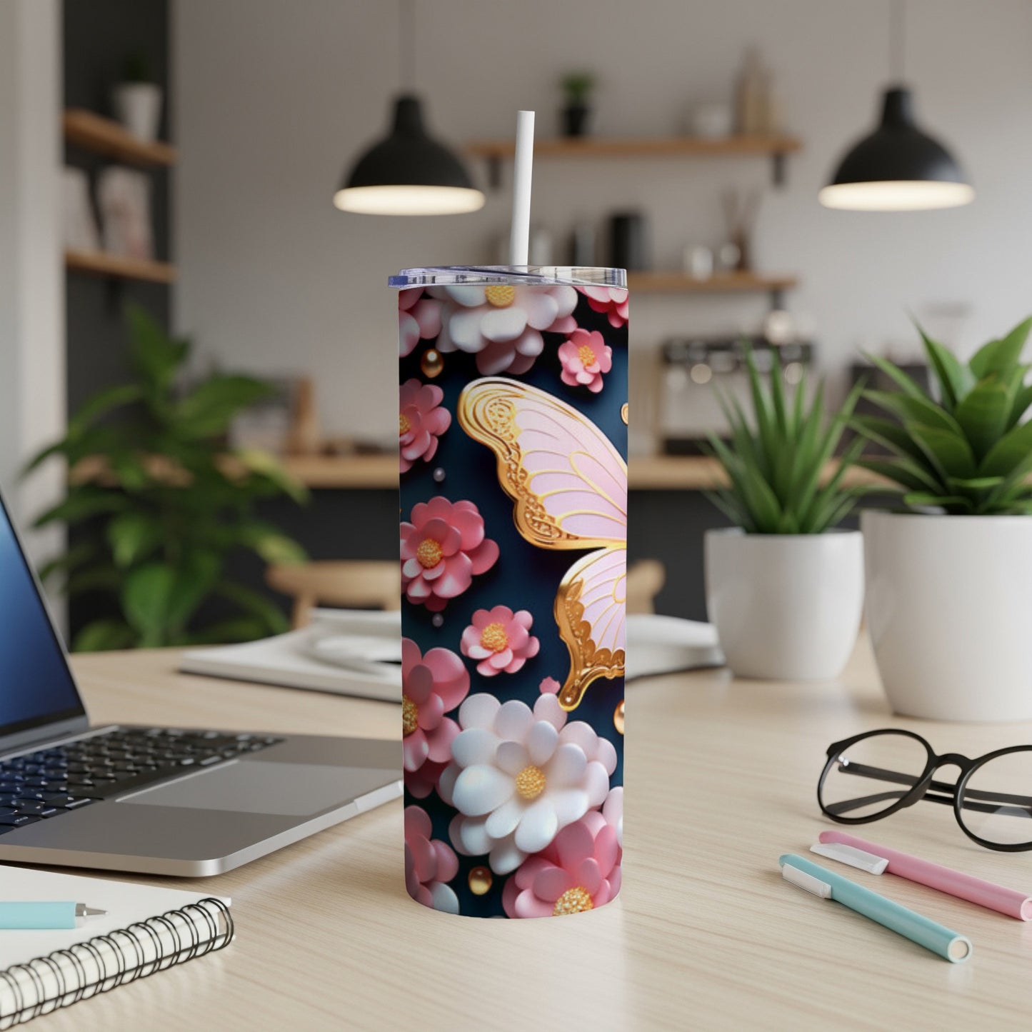 Pink butterfly and floral pattern on a 20oz insulated tumbler.