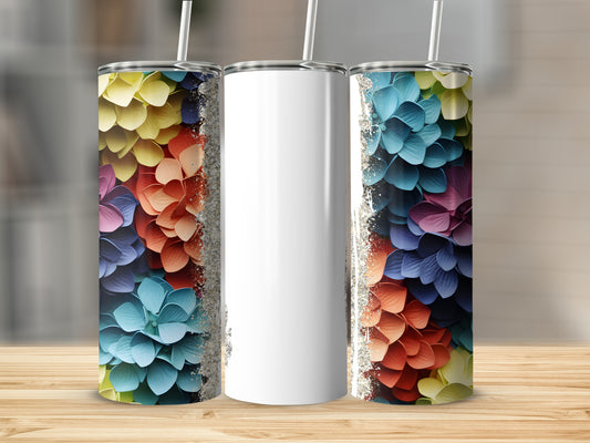 Three tumblers with colorful floral patterns and glitter accents.