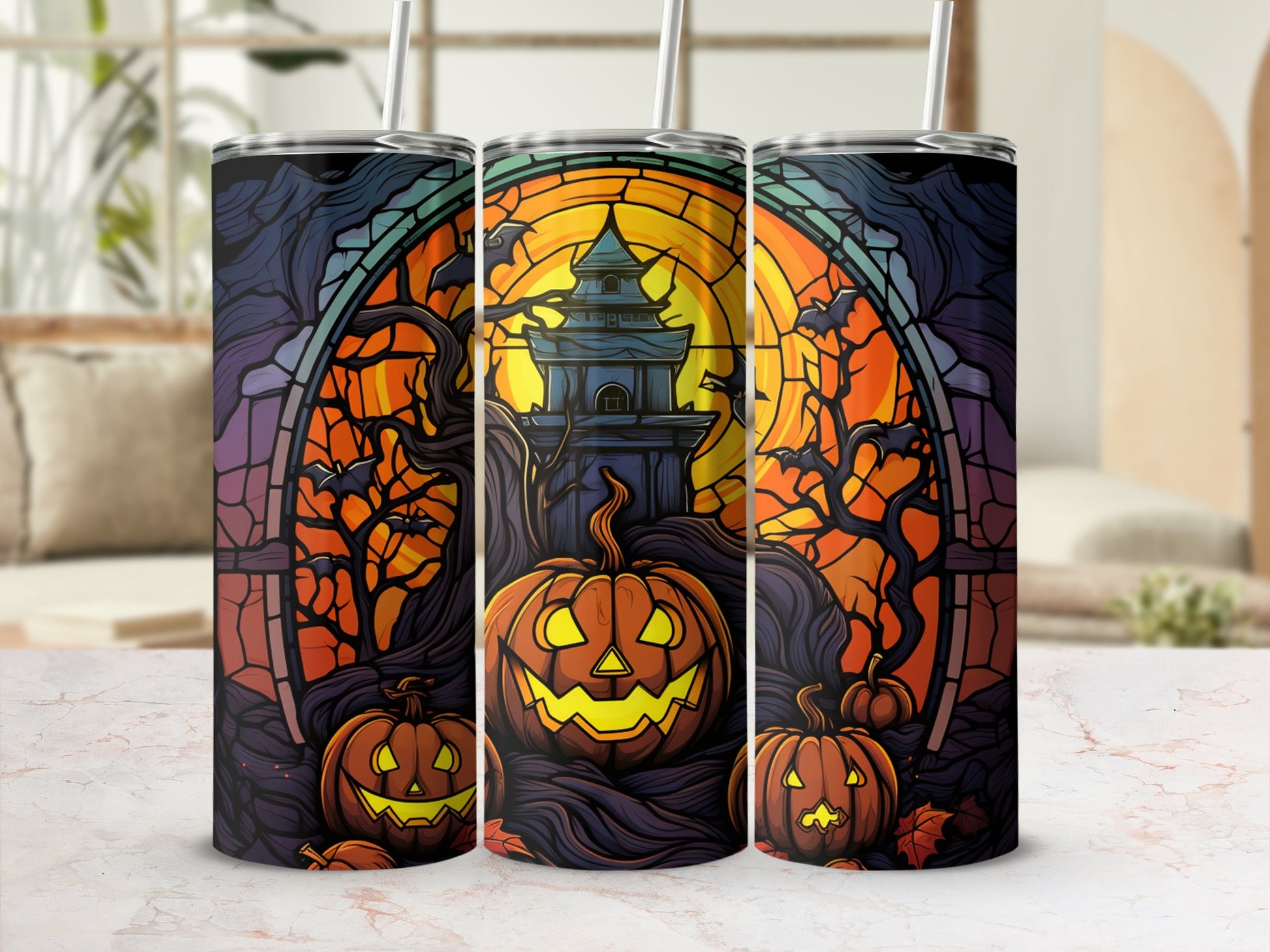 Three Halloween tumblers featuring stained glass designs of pumpkins and haunted castles.