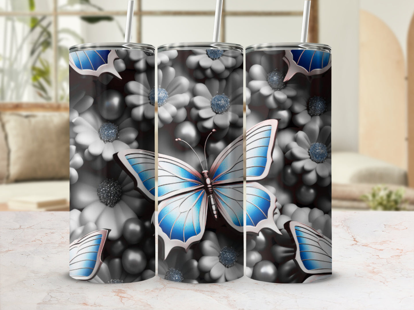 Triptych of tumblers with blue butterfly and white floral pattern.