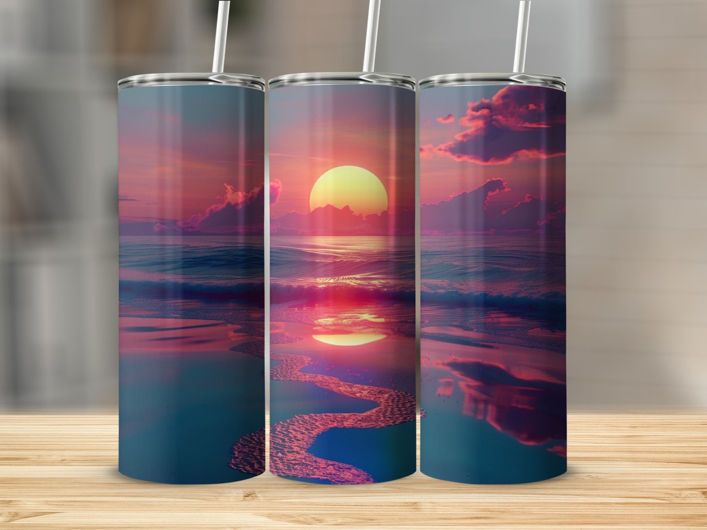 Three tumblers featuring a sunset over an ocean with reflections.