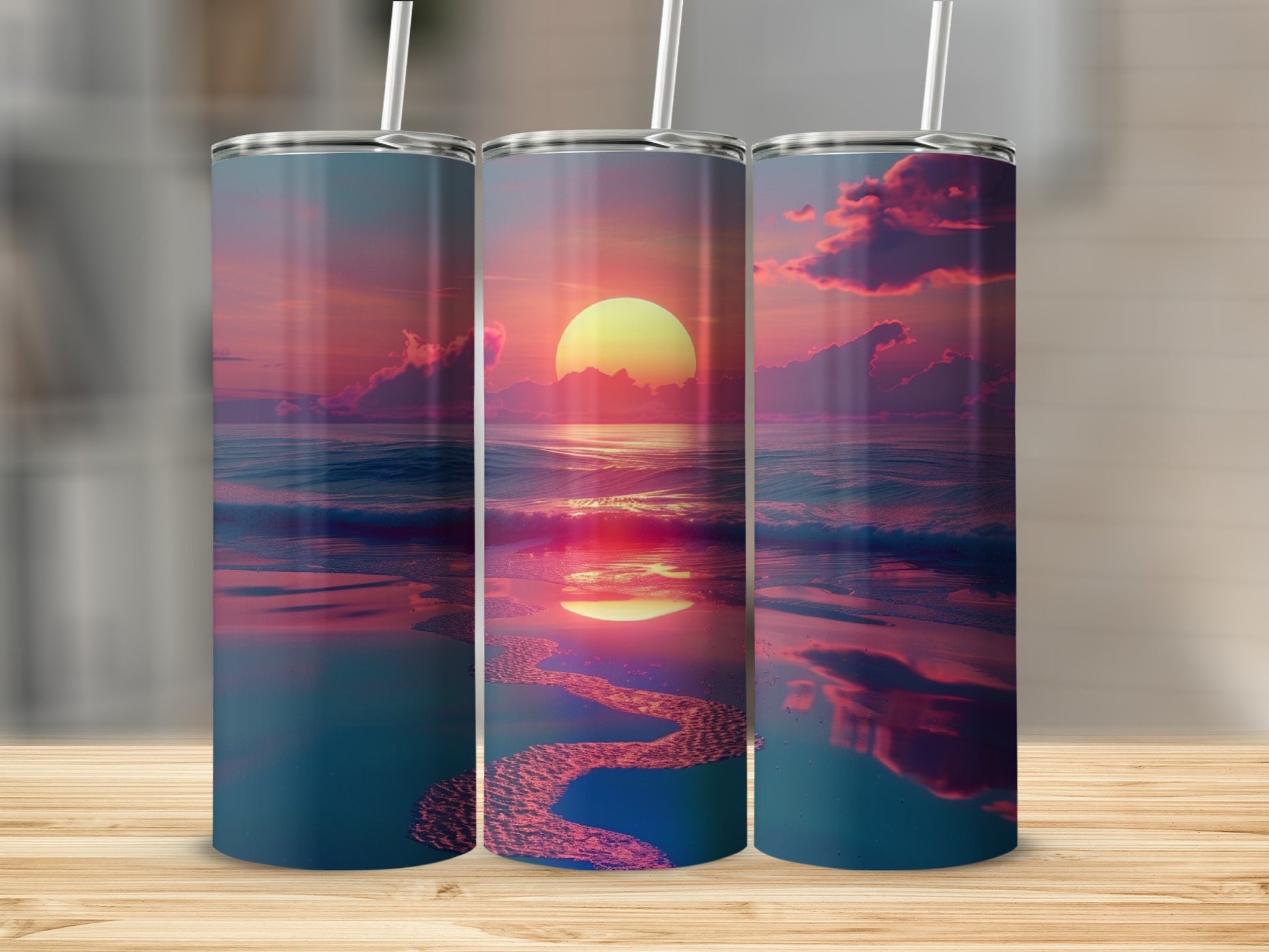 Three tumblers featuring a sunset over an ocean with reflections.