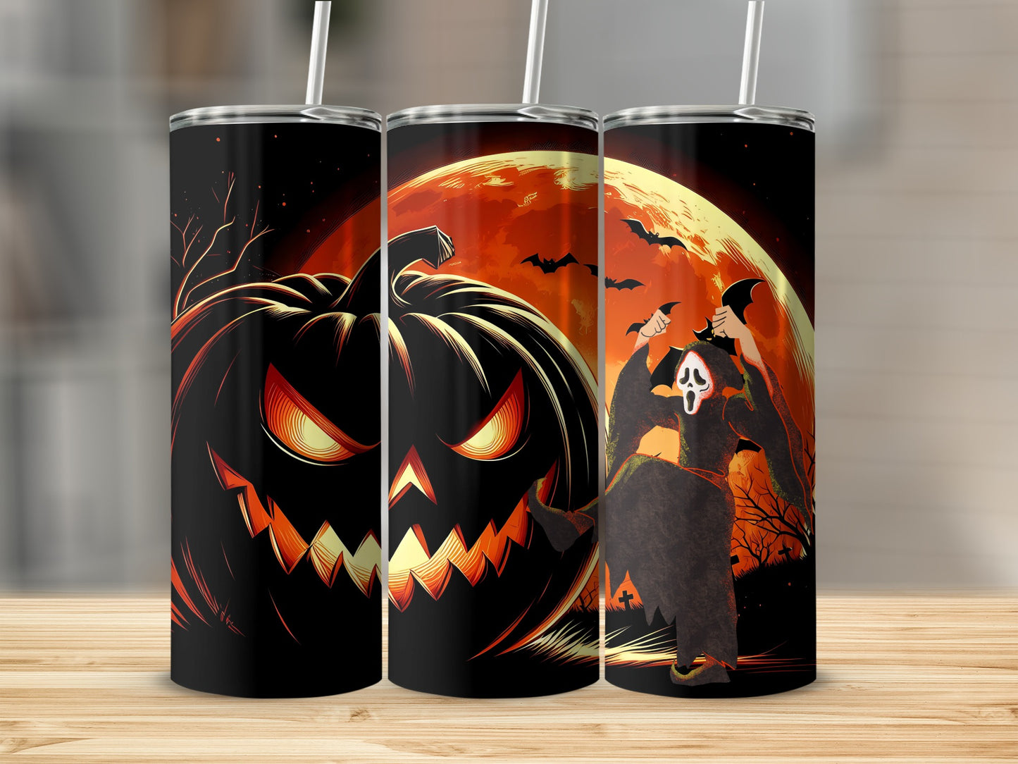 Three tumblers with a Halloween design featuring a jack-o'-lantern and a ghost.