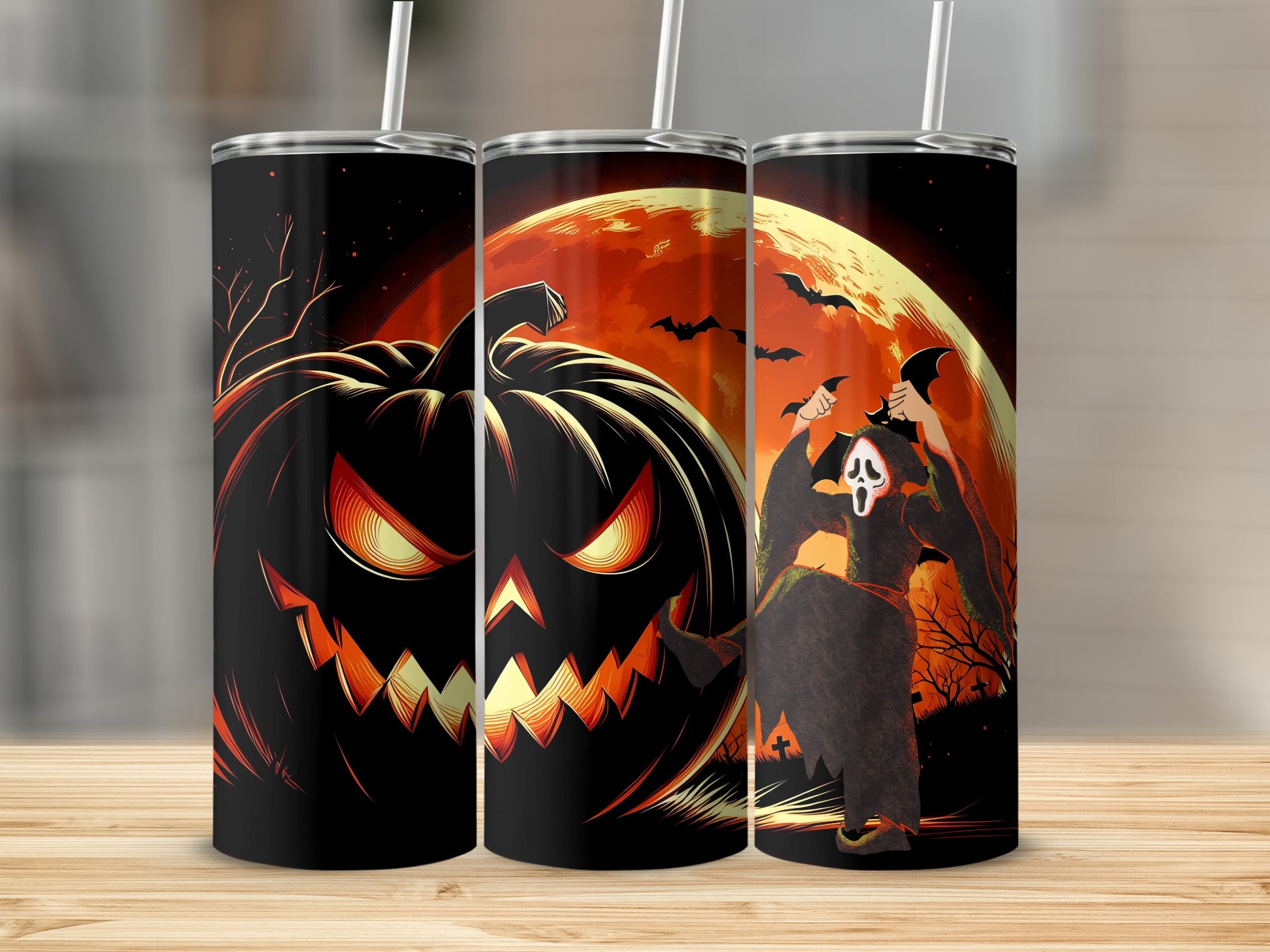 Three tumblers with a Halloween design featuring a jack-o'-lantern and a ghost.
