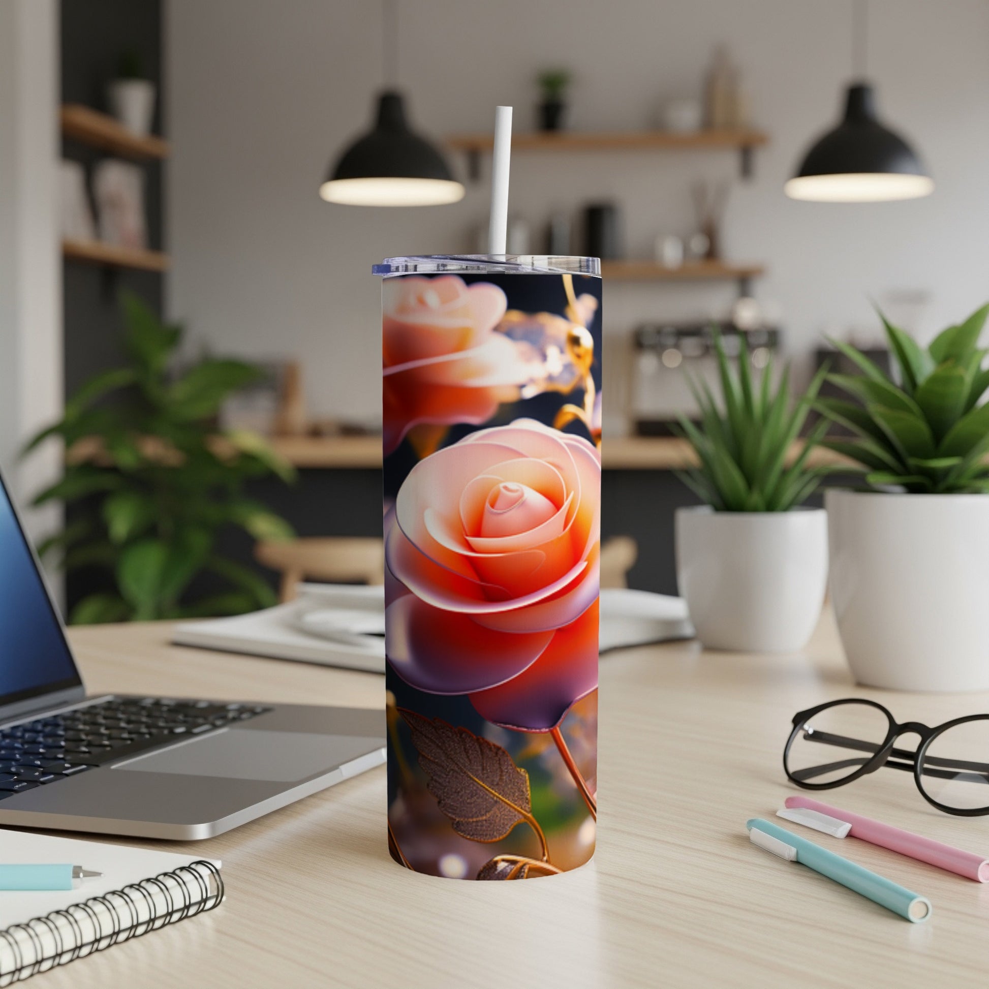 Rose design on a stainless steel tumbler with straw.