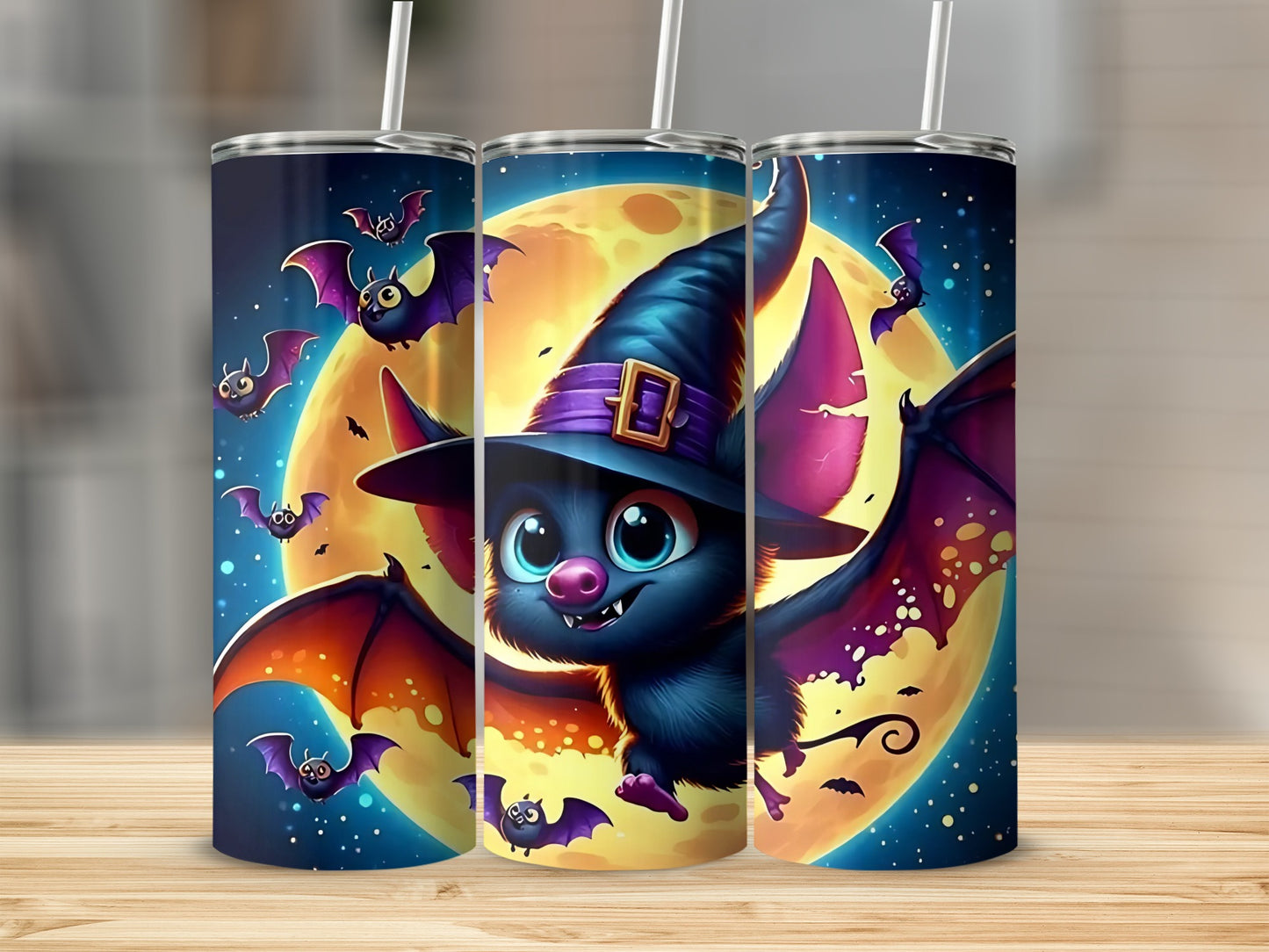 Three tumblers feature a cartoon bat in a witch hat with a full moon and flying bats.