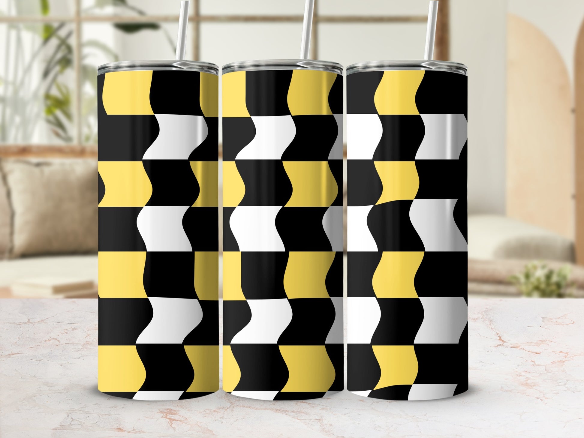 Three tumblers with a black, white, and yellow geometric wave pattern.