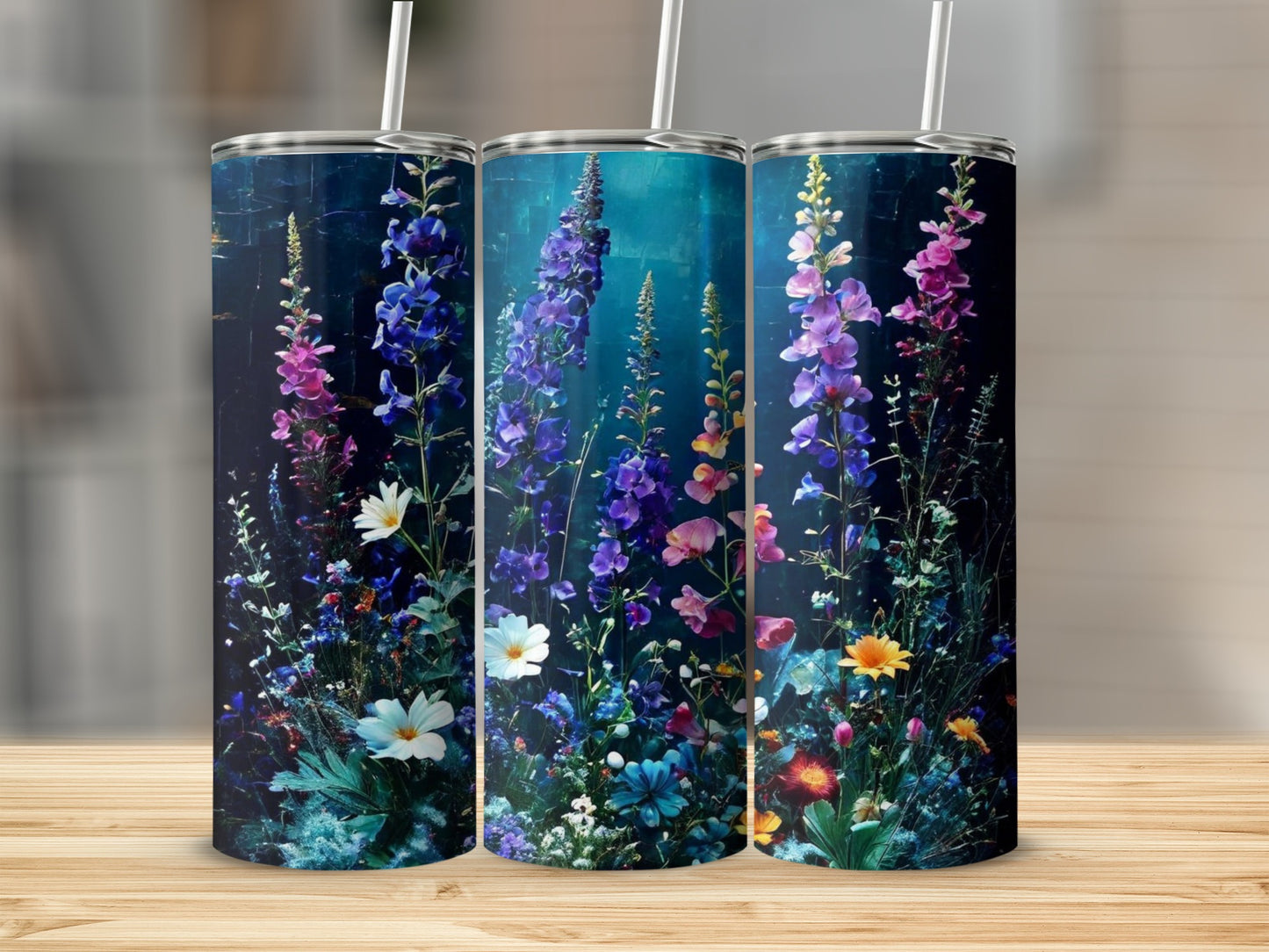 Floral pattern with blue and pink wildflowers on three tumblers.