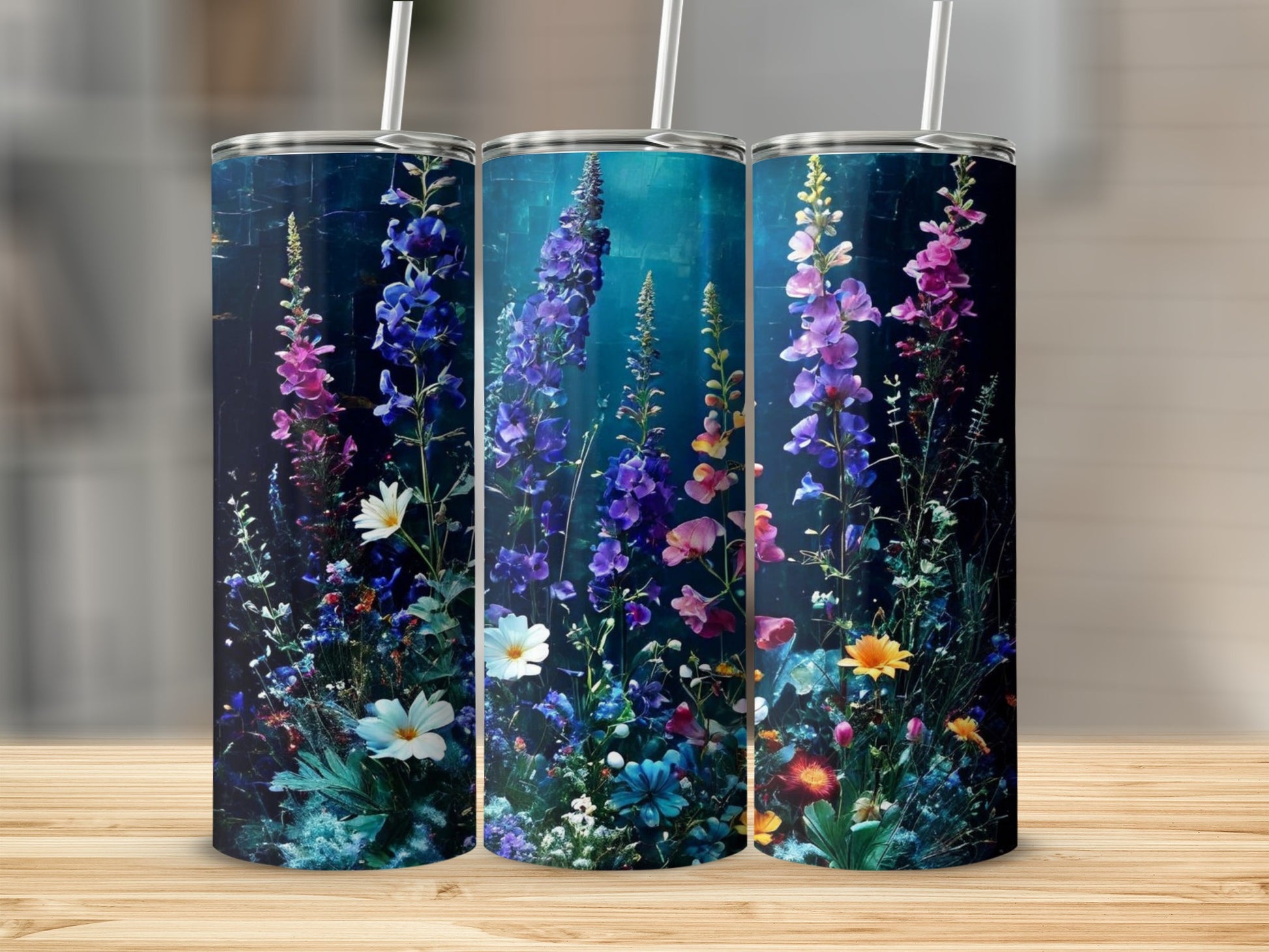 Floral pattern with blue and pink wildflowers on three tumblers.